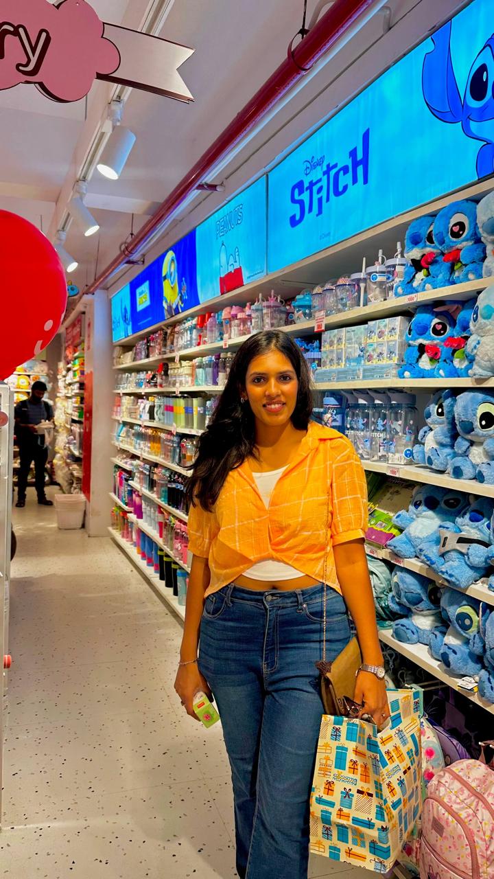 Sakshi in a yellow shirt and jeans